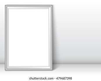 Photoframe template. Silver picture framing mockup. Frame near the wall on the floor with realistic shadows. Vector template for presentation your photo art or other crafts.