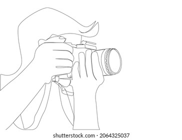 A photographer adjusts his camera. drawing concept photography and technology industry