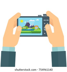 Photographer with a camera in his hands. Snapshot of mountain landscape. Flat vector cartoon illustration. Objects isolated on white background.