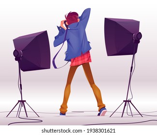 Photographer with camera take shots in studio