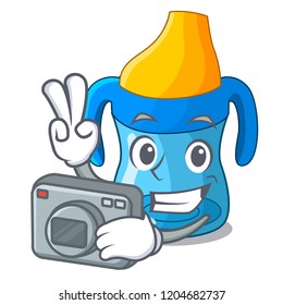 Photographer cartoon baby drinking from training cup