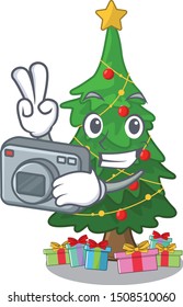Photographer christmas tree next to cartoon table