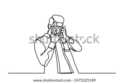 photographer, continuous line drawing professional young man photographer. Man-making photos with a camera. Single-line photographer takes pictures using camera isolated on a white background.