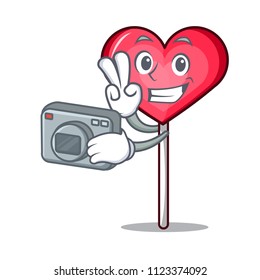 Photographer heart lollipop mascot cartoon