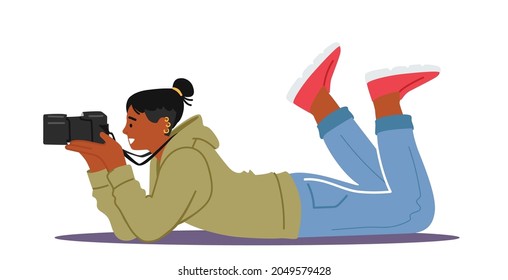 Photographer Male Character with Photo Camera Lying on Ground Making Professional Pictures. Cameraman Expert Job, Creative Hobby, Paparazzi or Journalist Work. Cartoon Vector Illustration