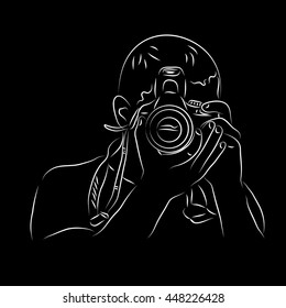 Photographer. A man with a camera in hand. Vector illustration drawn by hand.