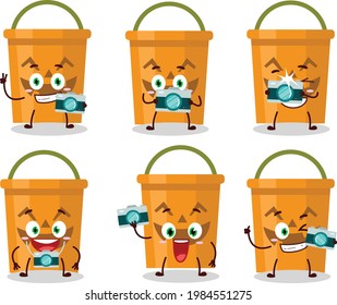 Photographer profession emoticon with halloween bucket cartoon character