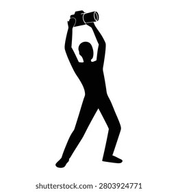 Photographer silhouette holding camera high above head for action shot