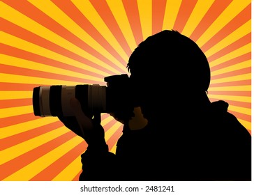 Photographer silhouette with sunburst as background