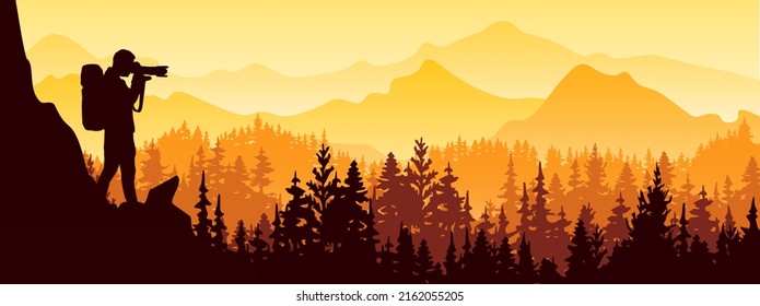 Photographer stands on top of rock take picture of landscape. Mountains and forest in background. Orange and yellow silhouette illustration. 