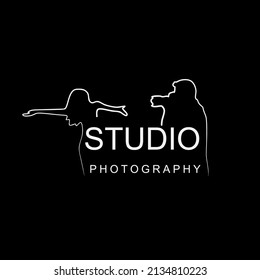 Photographer takes pictures, vector logo. Front View. Man with digital camera