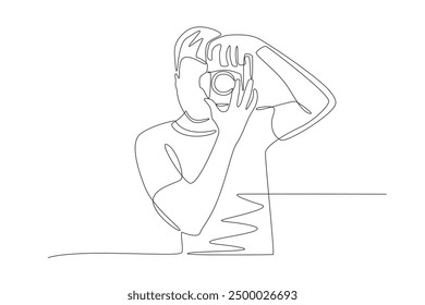 The photographer is taking photos. World photography day concept one-line drawing