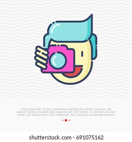 Photographer thin line icon, man is holding camera near his face. Vector illustration for logo.