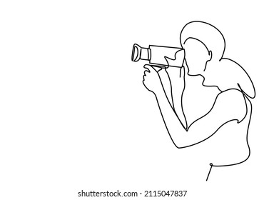 photographer waiting to record with camera in hand