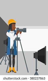Photographer working with camera on a tripod.