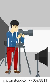Photographer working with camera on a tripod.
