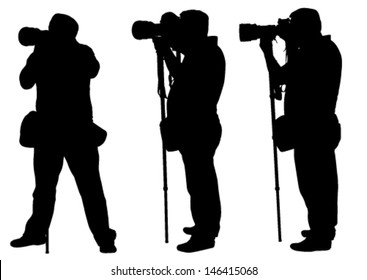 photographers with monopod silhouettes