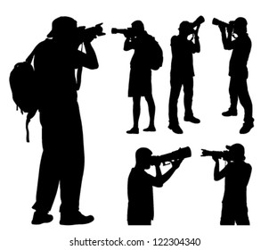 photographers with telephoto lens silhouettes