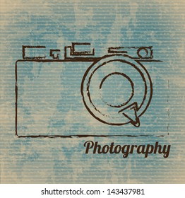 photographic camera drawn freehand over vintage background vector illustration