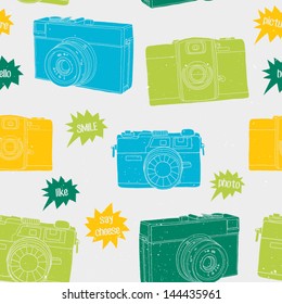 Photography seamless pattern. Hand drawn photo cameras background in green and yellow color. Vector illustration