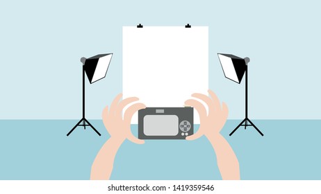 Photography Studio With Light and white curtain setup and hands taking picture