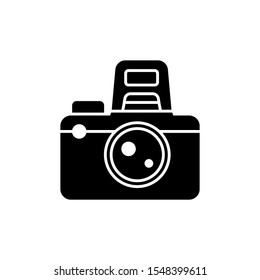 photography vector icon. dslr camera with flash with isolated white background. color can be changed. glyph style