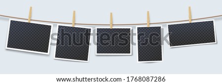 Photos hanging on rope attached with clothes pins. Blank instant photo frames with transparent place isolated on white background. Wooden clothes pegs with photography vector illustration Foto stock © 