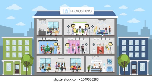 Photostudio interiors city building with people and equipment.