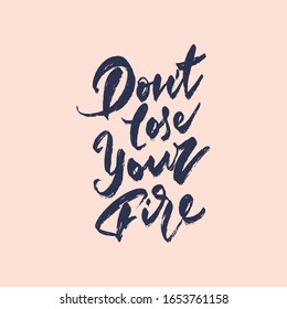 Phrase " Don't lose your fire". Handwritten inscription made with a rough brush