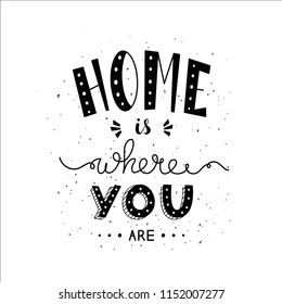 Phrase Home is where you are. Hand drawn lettering in black and white. Inspirational quote. 