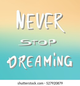 Phrase Never stop dreaming.  Handwritten phrase on the blurred  background.