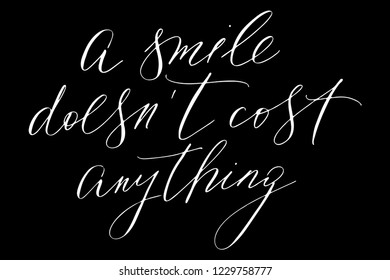 Phrase a smile doesn't cost anything handwritten text vector