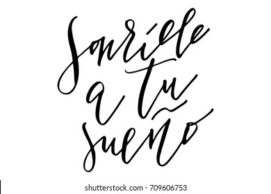 Phrase spanish writing lettering smile to your dream handwritten text vector.