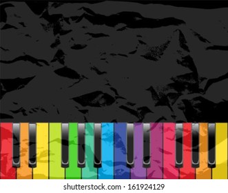 piano with color keys on a black shabby background