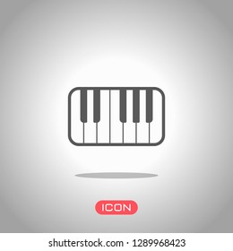 Piano keyboard icon. Icon under spotlight. Gray background