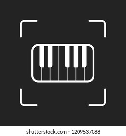 Piano keyboard icon. White object in camera autofocus on dark background