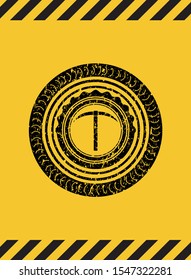 pickaxe icon black grunge emblem with yellow background. Vector Illustration. Detailed.