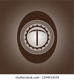 pickaxe icon inside badge with wood background
