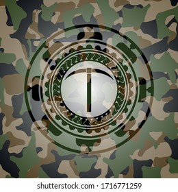 pickaxe icon inside camouflaged emblem. 