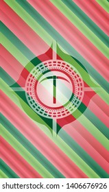 pickaxe icon inside christmas badge background.