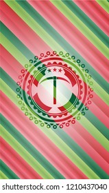 pickaxe icon inside christmas colors style emblem.