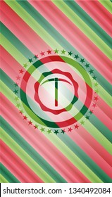 pickaxe icon inside christmas colors style badge.