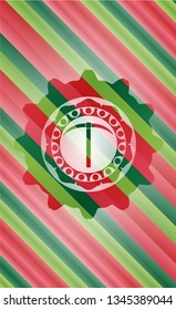 pickaxe icon inside christmas colors style badge.
