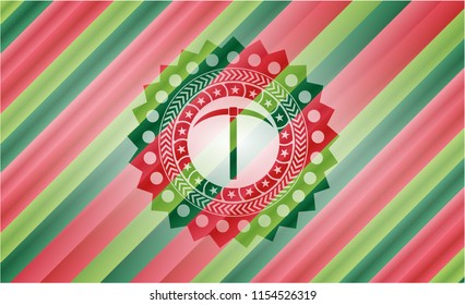 pickaxe icon inside christmas emblem.