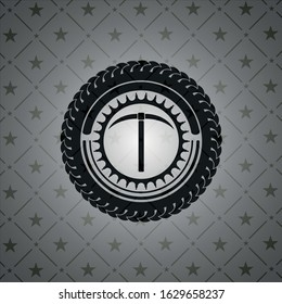 pickaxe icon inside dark badge or emblem