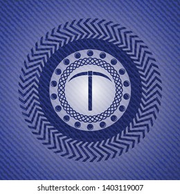pickaxe icon inside emblem with jean background