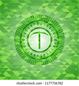 pickaxe icon inside green emblem. Mosaic background