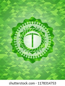 pickaxe icon inside green emblem with mosaic ecological style background