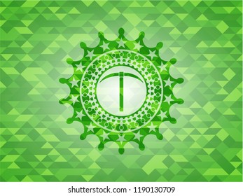 pickaxe icon inside green emblem with mosaic background