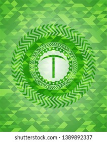 pickaxe icon inside green mosaic emblem